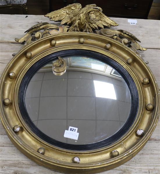 A Regency style convex wall mirror H.2ft9in.